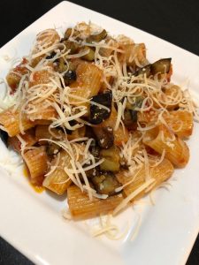 pasta on white plate with vegan cheese