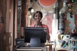 a happy waitress in a vegan business
