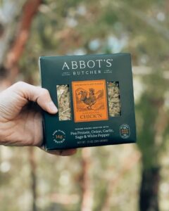hand holding abbots butcher chickn pea protein onion garlic sage white pepper