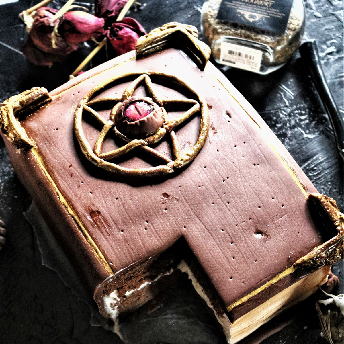 grimoire spell book vegan double dark chocolate cake with piece missing
