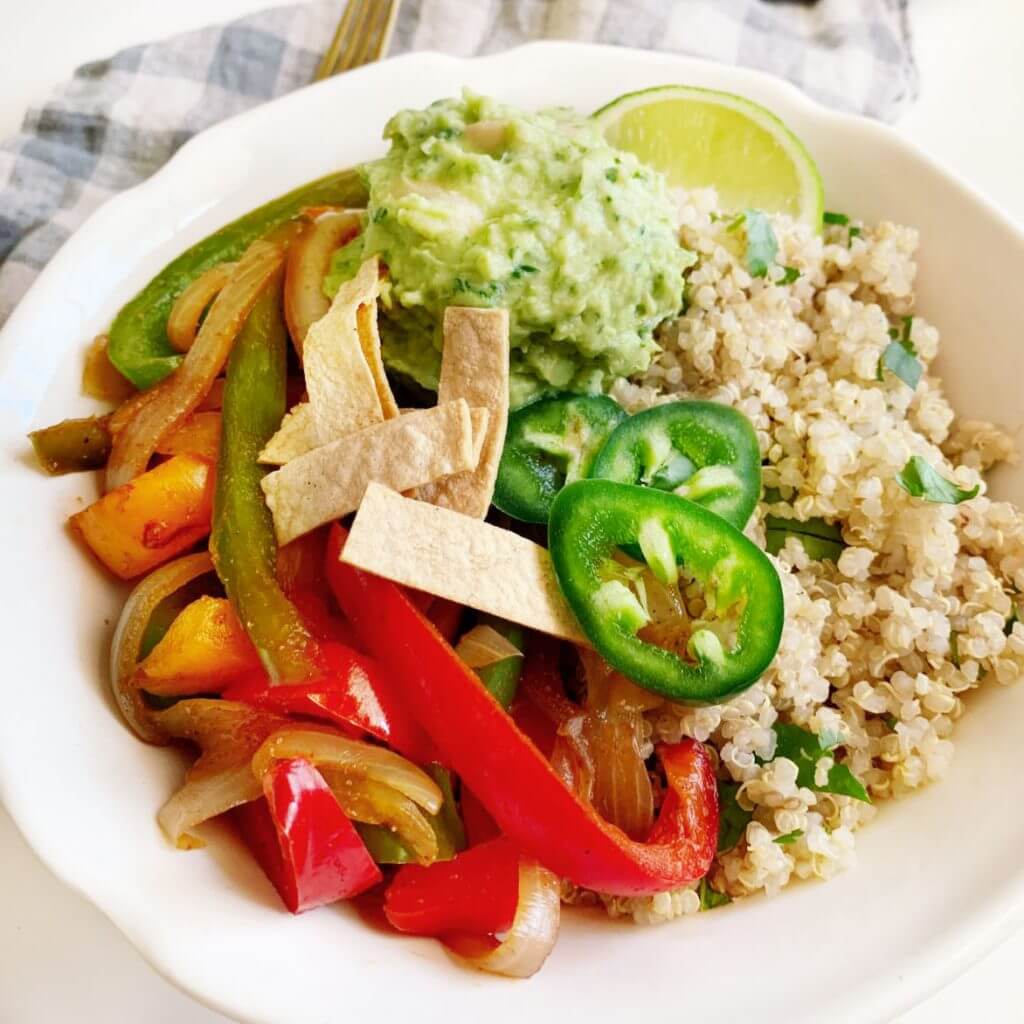 bowl with quinoa guacamole peppers jalapeños and tortilla strips