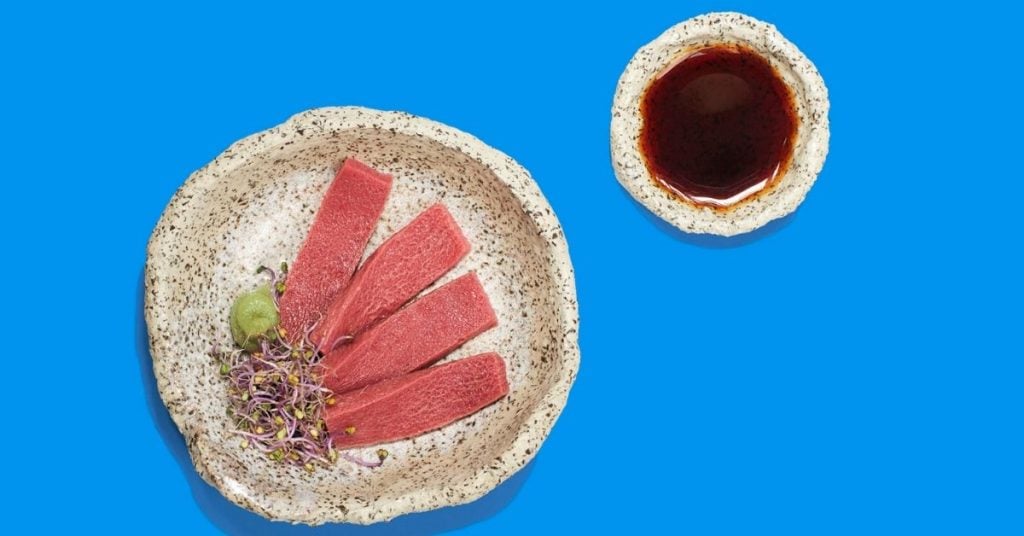 vegan tuna on plate with blue background