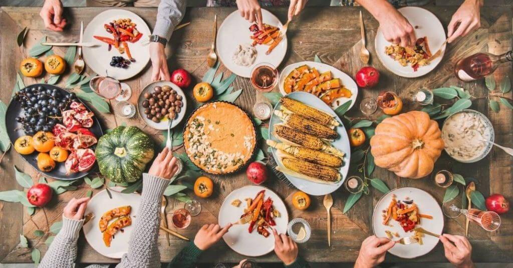 vegan-thanksgiving-with-table-filled-with-dishes