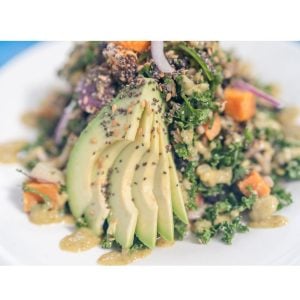 seaside eatery quinoa salad with avocado slices sesame seeds dressing