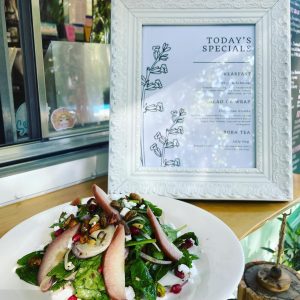 seaside eatery daily special menu green salad with pear slices pomegranate