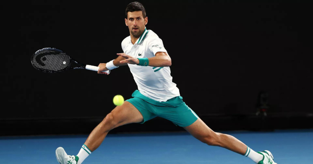 Novak Djokovic swinging at tennis ball