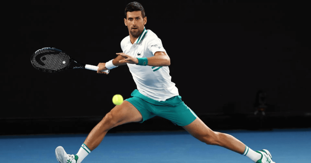 Novak Djokovic swinging at tennis ball
