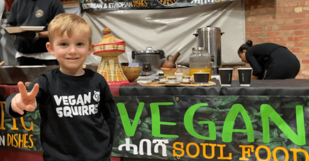 Harry Bidwell using peace sign