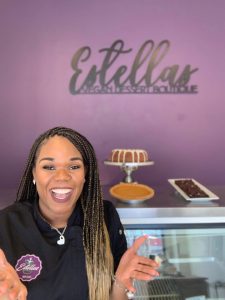 employee greeting at counter of estella's