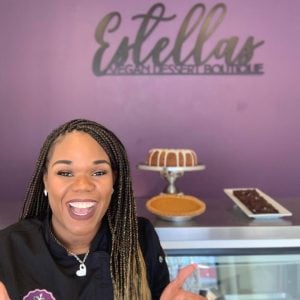 employee greeting at counter of estella's