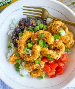 the Plant Based Seafood Co. bowl of shrimp over rice beans tomato