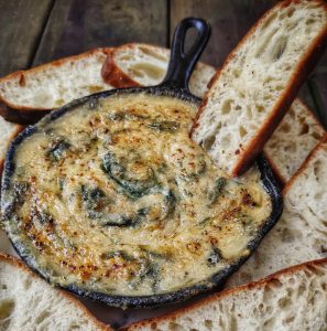 the uncreamery spinach and artichoke dip with sourdough bread