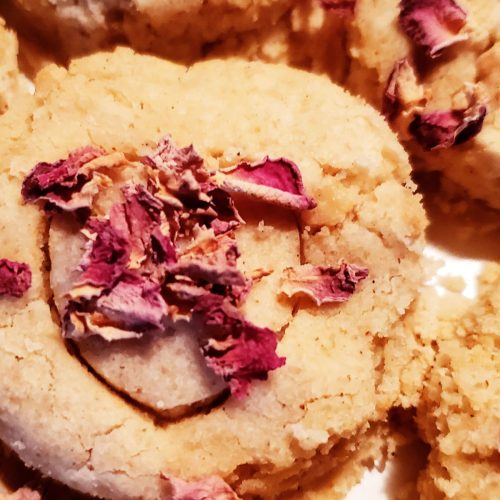 vegan rose cardamom cookies decorated with dried rose petals