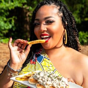 Black woman with braids eating