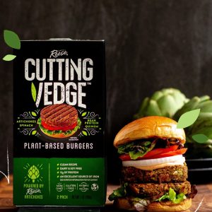 cutting vedge box next to burger with two vegan patties onion tomato lettuce between two buns