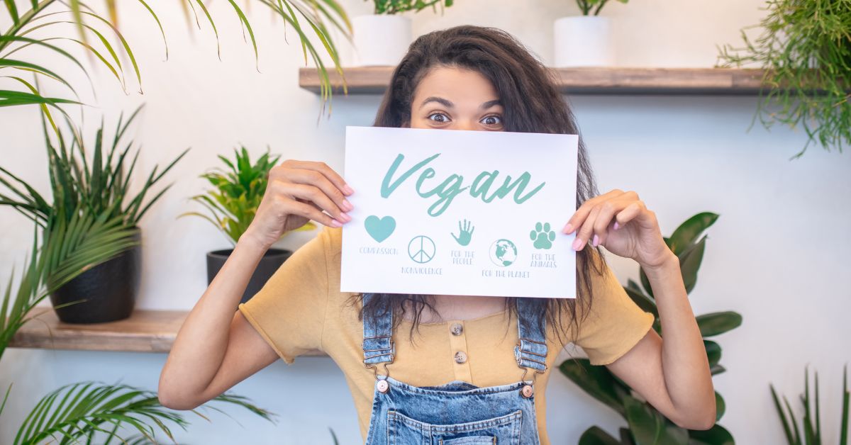 Girl with Veganism sign