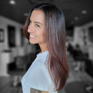 vegan colorist smiling woman with long dark glossy hair