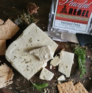 Peaceful Rebel Herbed Feta Vegan Cheese with crackers