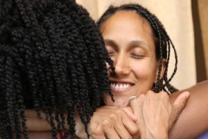two people happy and hugging