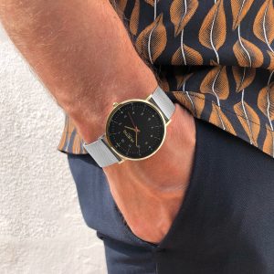 Hurtig Lane Watch around wrist with hand in pocket